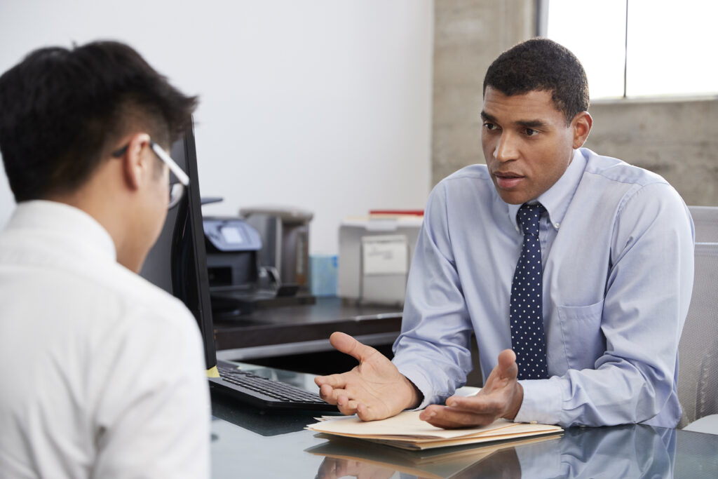 A professional with a sales mindset is having a serious conversation